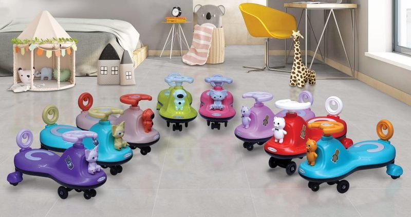 A large collection of Funfizz swing cars in every colour, arranged across the floor of a child's bedroom