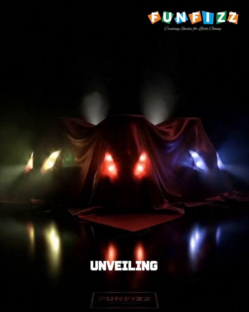 A new Funfizz ride-on under a cover on a dark stage, its headlights glowing through the cloth