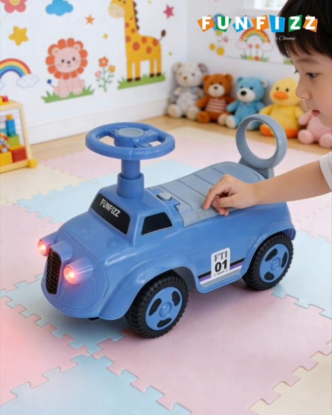 A child reaching for a blue Funfizz ride-on car on a soft play mat in a nursery