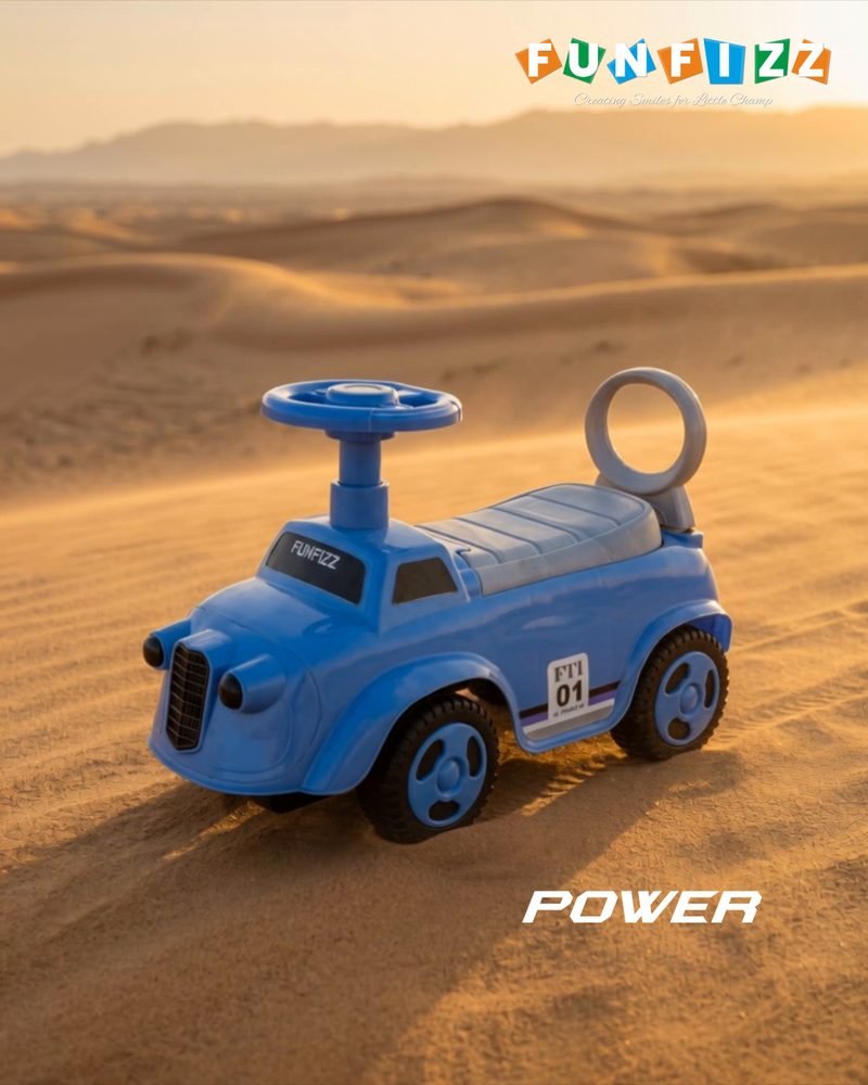 A blue Funfizz vintage-style ride-on car on desert sand dunes at golden hour
