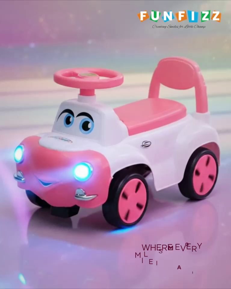 A pink Funfizz ride-on car with a cartoon face, glowing headlights and a high backrest, on a pastel studio backdrop